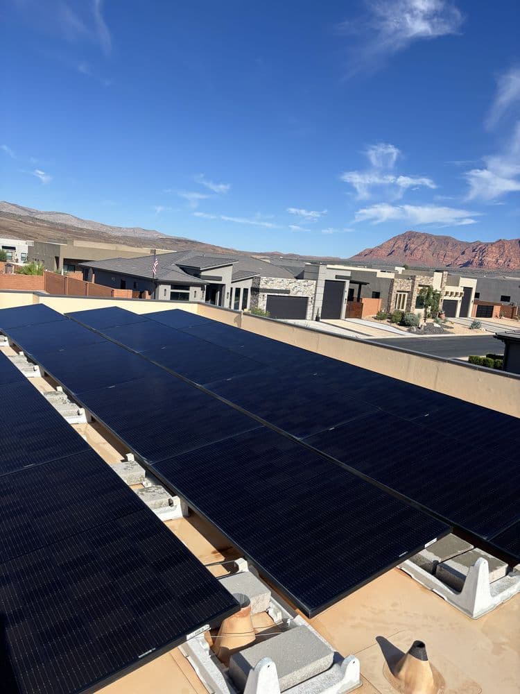 Clean solar panels with Southern Utah red rocks behind